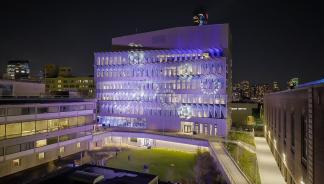 Vagelos Laboratory for Energy Science and Technology illuminated in blue, purple, and white lights